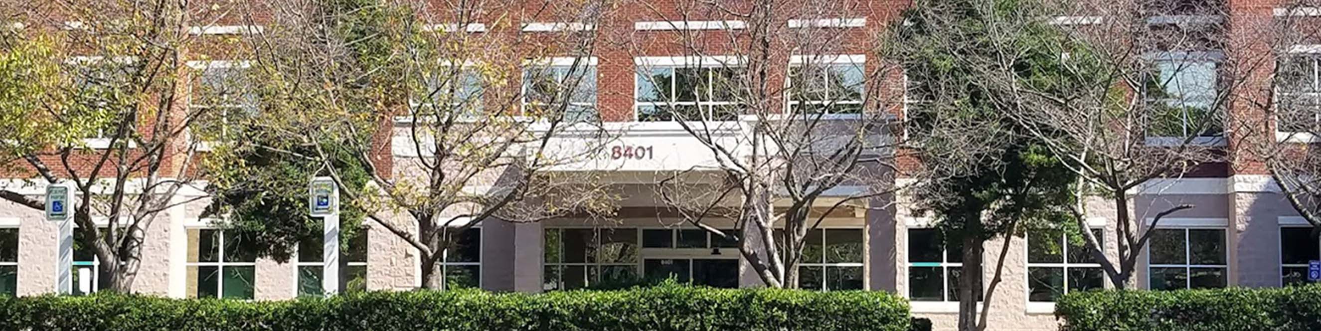 Front of the dermatology office at University in the Novant Health building, near WT Harris Blvd and parking.